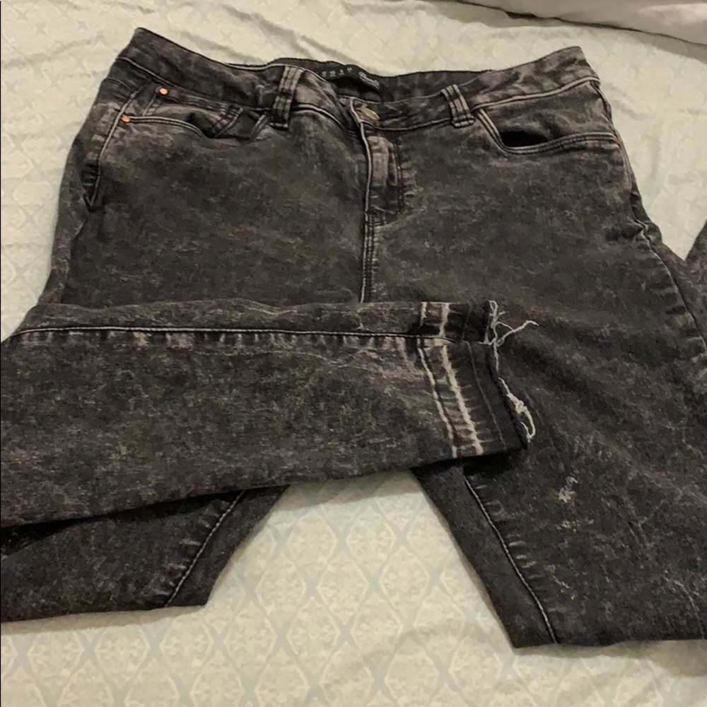 Distressed black jeans.